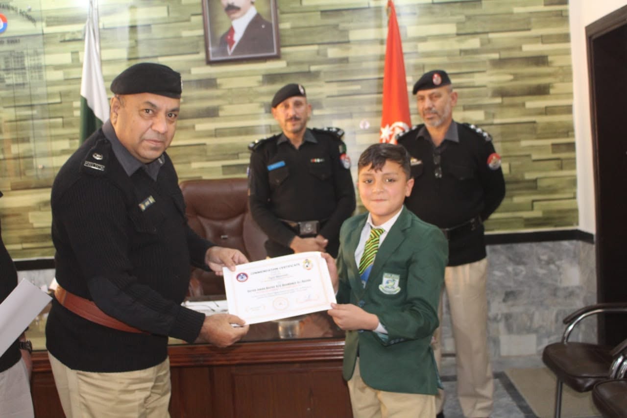 Student receiving a certificate at a ceremony