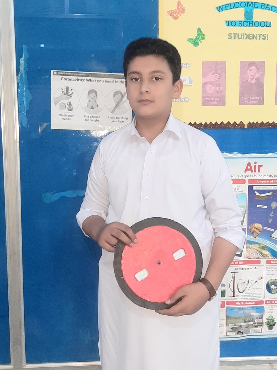 Student presenting a science model in class