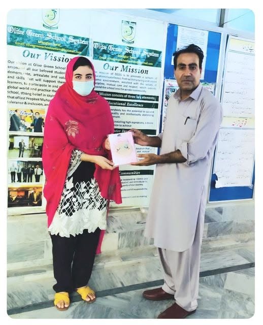 Student receiving an award certificate