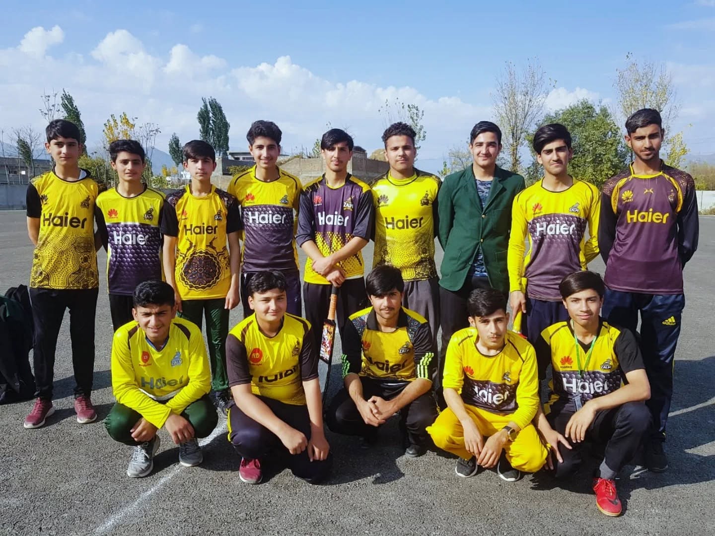 Olive Green school sports team in green and yellow kit