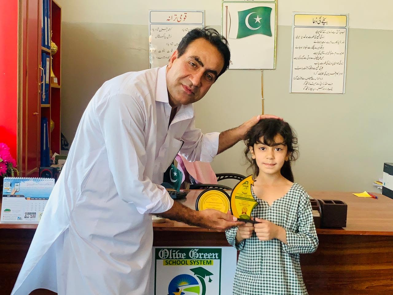 Primary student receiving a prize